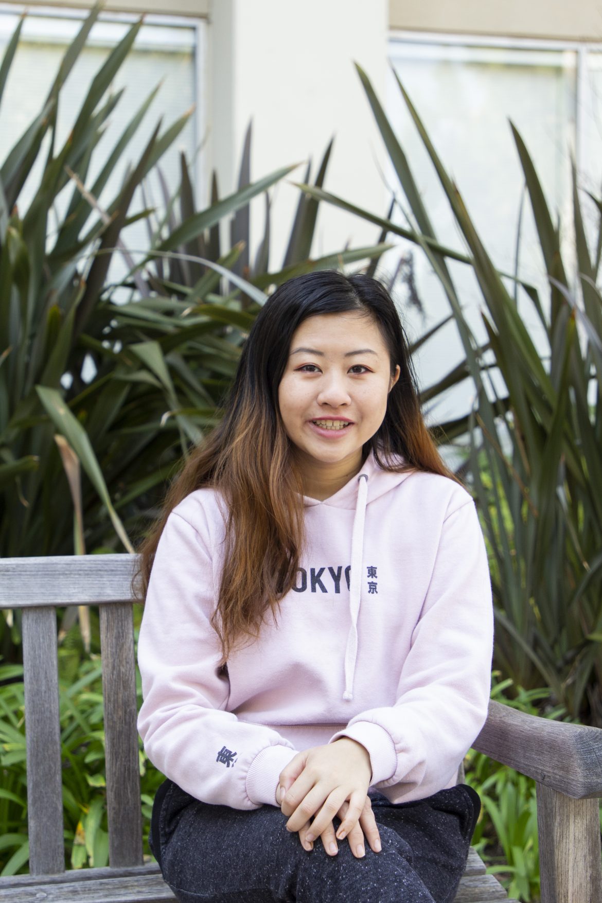 UCLA student with dyed hair sitting on a bench UCLA Styles: Dyed Hair