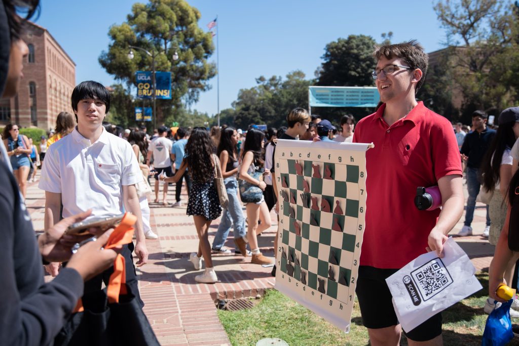 UCLA Chess Club attracts students with a chess puzzle and the incentive of a prize. Although the club met a small lull during the beginning of the COVID-19 pandemic, it — like many clubs — was able to attract and maintain a passionate club body since. Photo by Julia Gu/BruinLife.