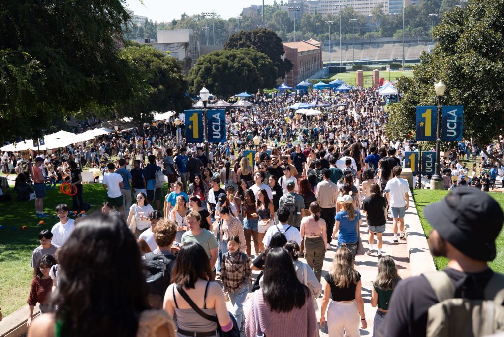 Students walk down toward the busy Wilson Plaza. The Enormous Activities Fair is an annual event that takes place above and below Janss Steps, attracting thousands of students per year. Photo by Julia Gu/BruinLife.