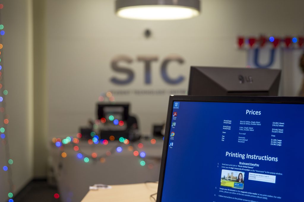The Student Technology Center on the lobby floor of Covel Commons is decorated with lights during the holiday season. The center has two machines and eight computers on which students can print, scan and photocopy their work, with various rates posted throughout the room.