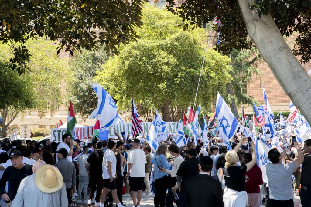 Pro-Palestine and pro-Israel protesters clash on Portola Plaza. Photographed by Emily Chandler/BruinLife.