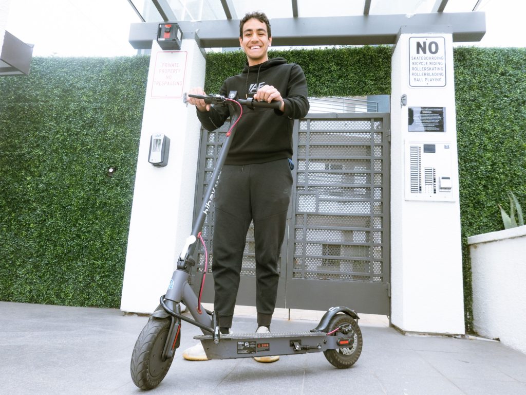 Shaan Kewalramani praised the convenience his scooter gives him, saying, “I get 20 more minutes of sleep every night." Photographed by Finn Martin/BruinLife.