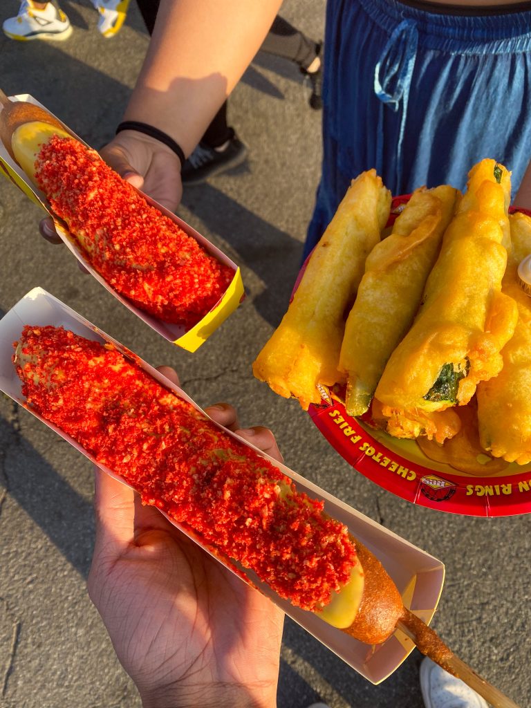Fried zucchini and giant corndogs covered in nacho cheese and hot cheeto crumbs.