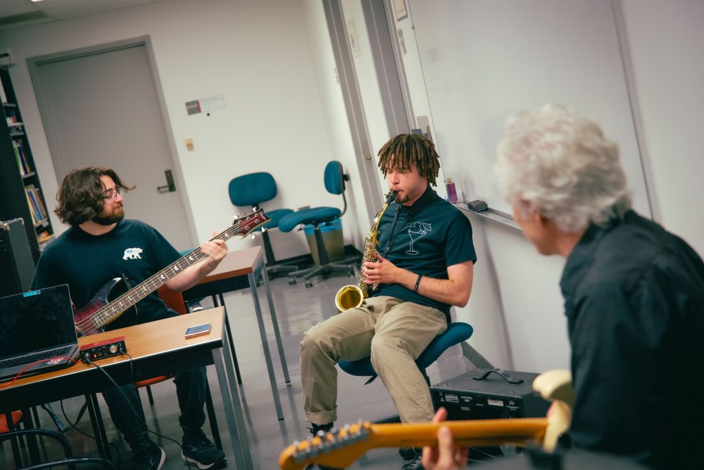 Left to right, Jonah Nahoul, third year bassist who has played for four years, MCDB major and Bioinformatics minor; Stafford Williams, third year saxophonist and Neuroscience major; Doctor Eric Scerri, chemistry professor.