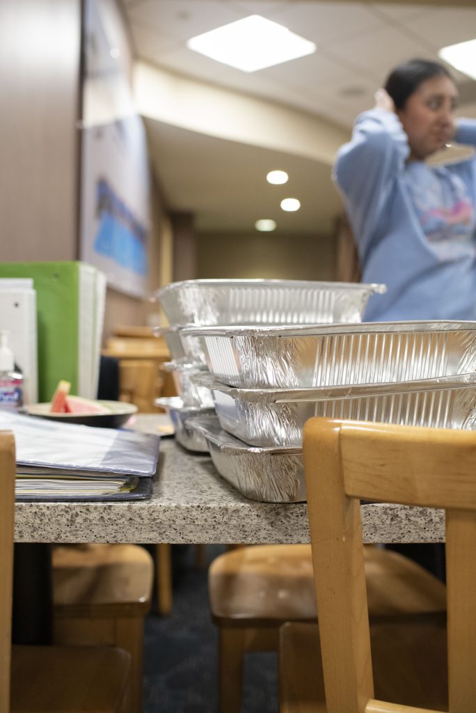 Five trays wait patiently in the dining hall at De Neve for recovery. Typical items include burgers from the Grill and the daily option from the Kitchen. Photographed by Julia Gu/BruinLife