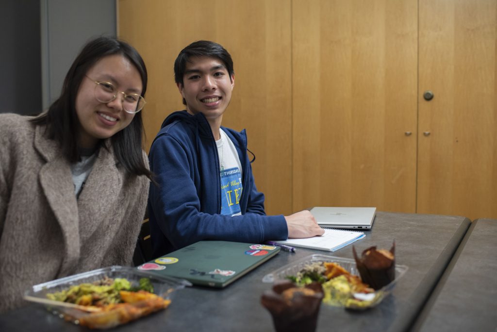 Mia Elliott (left) from UCLA Public Affairs and Aster Phan (right) pose for a photo. Many diners like Mia hope to volunteer with Bruin Dine to give back to a meaningful club. Photographed by Julia Gu/BruinLife