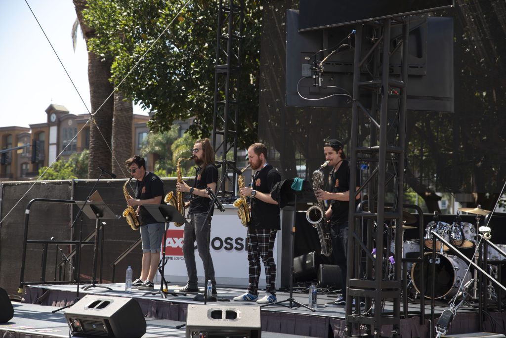 S4X performs on the stage in AX Crossing, providing live music and entertainment to Expo attendees as they eat. Photographed by Emily Chandler/BruinLife.