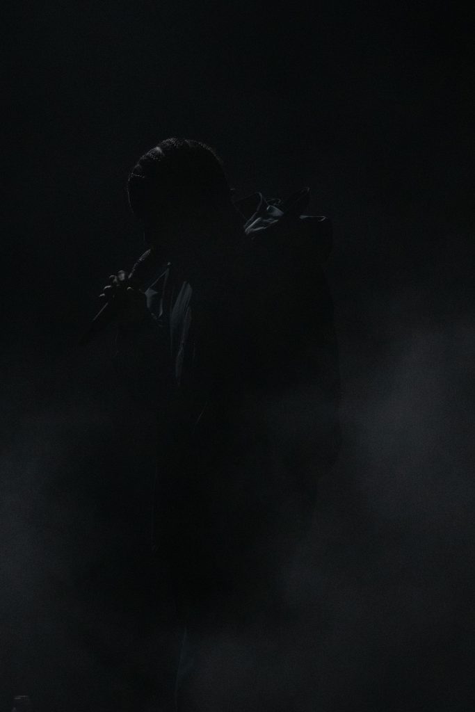 Daniel Caesar's shadowy figure amongst the fog as he prepared to sing one of his many hits. Photographed by Caleb Velasquez/BruinLife.