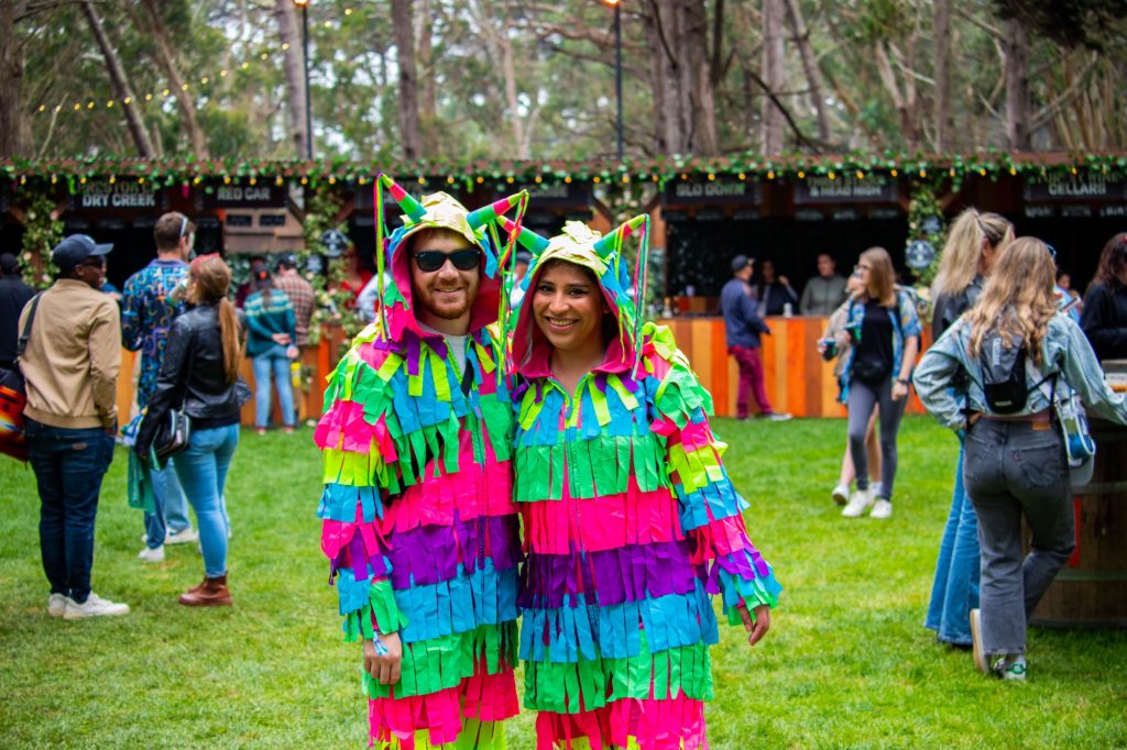 Festival goers on day two pose for a picture as they are dressed up as piñatas in Wine Lands. Photographed by Caleb Velasquez/BruinLife.