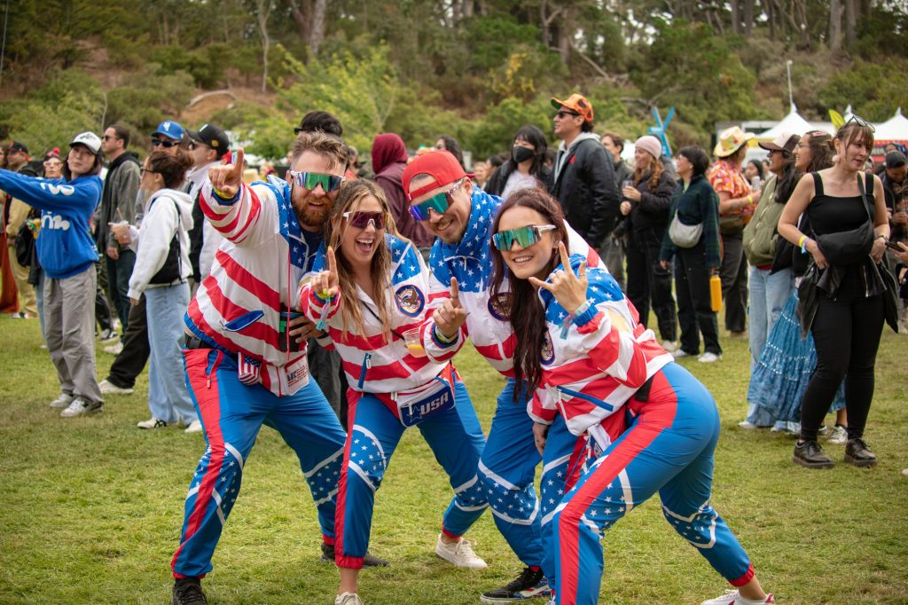 A group of four attendees sport USA themed tracksuits, fitting for Team USA's victory for the most gold medals along with Team China at the Paris 2024 Olympics. Photographed by Caleb Velasquez/BruinLife.