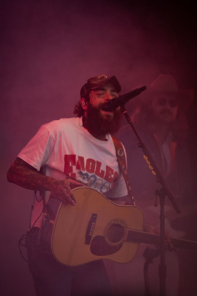 Artist Post Malone sings his rendition of "Carrying Your Love with Me." Notably, Post played his own acoustic guitar. Photographed by Caleb Velasquez/BruinLife.