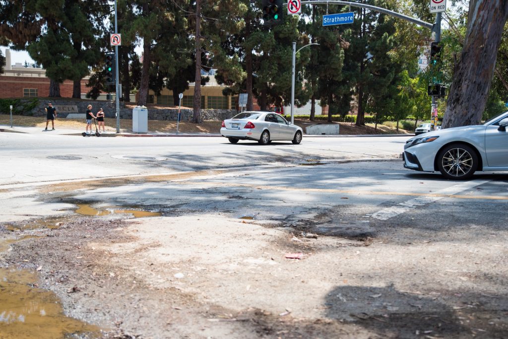 Potholes located near the intersection of Gayley Avenue and Strathmore Drive. 
Photographed by Caleb Velasquez/BruinLife.