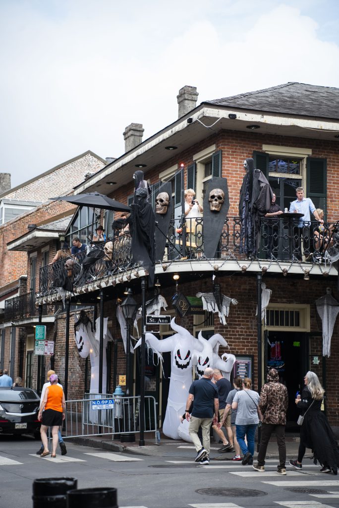 Inflatable ghosts and wooden coffins adorn the outside of a bar on Bourban Street. During Halloween, the streets were filled with decorations and festive sights. Photographed by Emily Chandler/BruinLife.