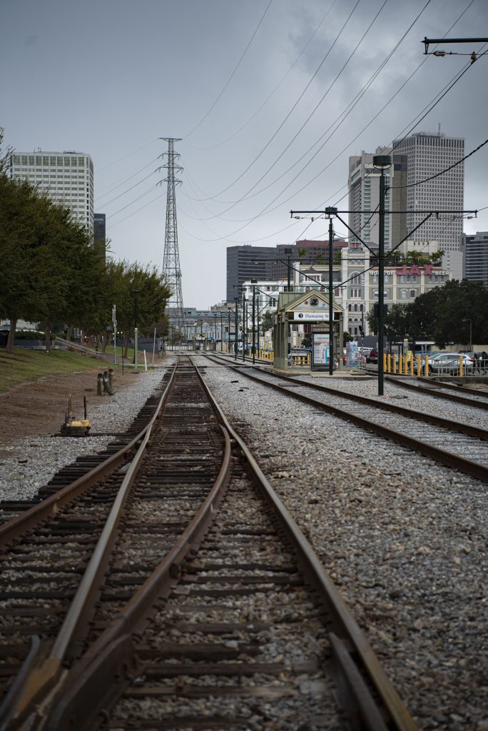 Railroad tracks along the Mississippi River run adjacent to the French Quarter. They have carried people to and from the heart of New Orleans in the past, present and into the future.  Photographed by Emily Chandler/BruinLife.