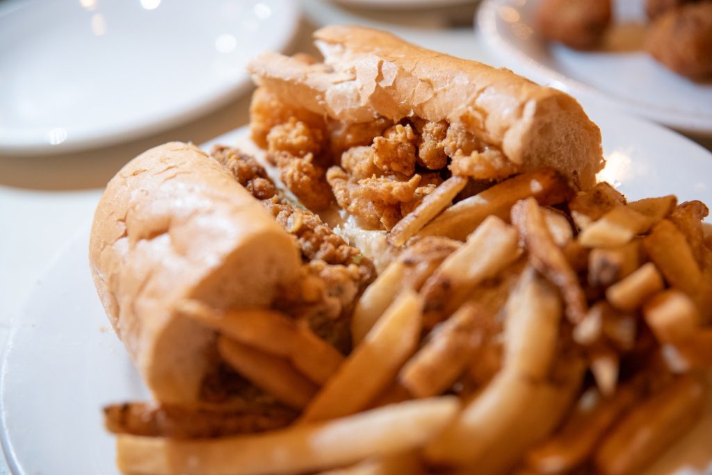 Though any Po-Boy can delight, a visitor to Felix's Restaurant and Oyster Bar ought not to go head first for one of these sandwiches and would be better advised ordering the freshly made oysters.  Photographed by Finn Martin/BruinLife.