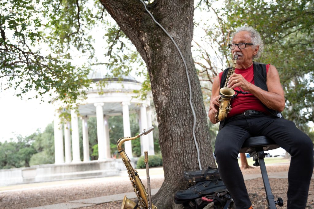 Steve the saxophonist plays a melody by Miles Davis in front a columned rotunda in New Orleans' City Park.  Like many others, Steve was drawn to the jazz scene of New Orleans and has performed there for most his life. Photographed by Finn Martin/BruinLife