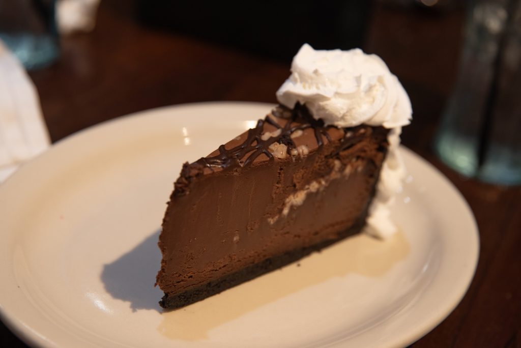 Chocolate Mousse with an Oreo crust, featuring a rich and smooth chocolate filling.