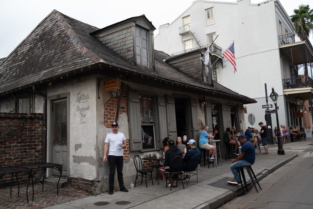 A shop bar stands with older architecture. Once upon a time, the store was a Spanish era smithery run by the city legend and privateer Jean Lafitte: now, Lafitte's Blacksmith Shop Bar on Bourbon Street offers a Bohemian late night and live music atmosphere in one of the city's oldest buildings. Photographed by Finn Martin/BruinLife.