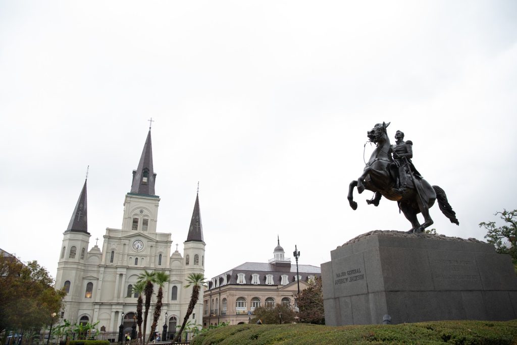 A statue of President Andrew Jackson rearing atop his warhorse dominates the center of Jackson Square in front of Saint Louis Cathedral.  Andrew Jackson's repulsion of the British from New Orleans during the War of 1812 fixed his place in the city's pantheon of heroes, as well as propelling him to the presidency. Photographed by Finn Martin/BruinLife.