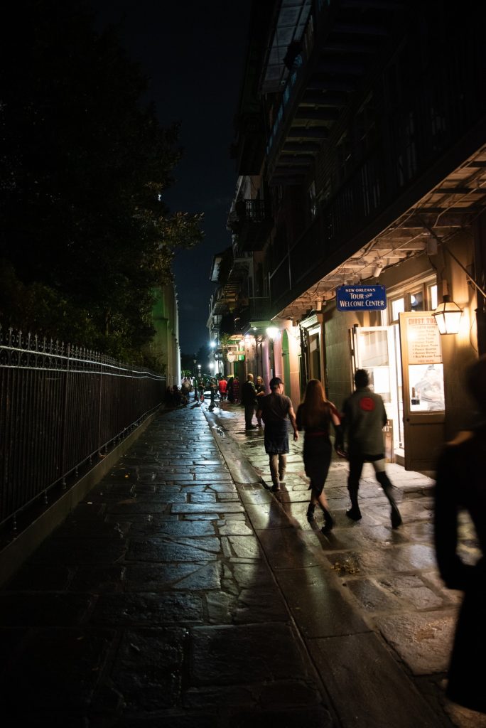 Following the footsteps of the Creole Revolutionaries of 1768, the ghost tour proceeds down Pirate Alley.  The French instigators of the Creole Revolution were chased down this alleyway by the forces of General Alejandro O'Reilly and caught and executed.  Photographed by Finn Martin/BruinLife.