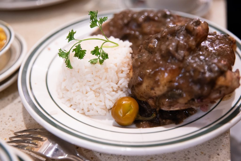 The chicken espagnole garnished with a cherry tomato.  Photographed by Finn Martin/BruinLife.