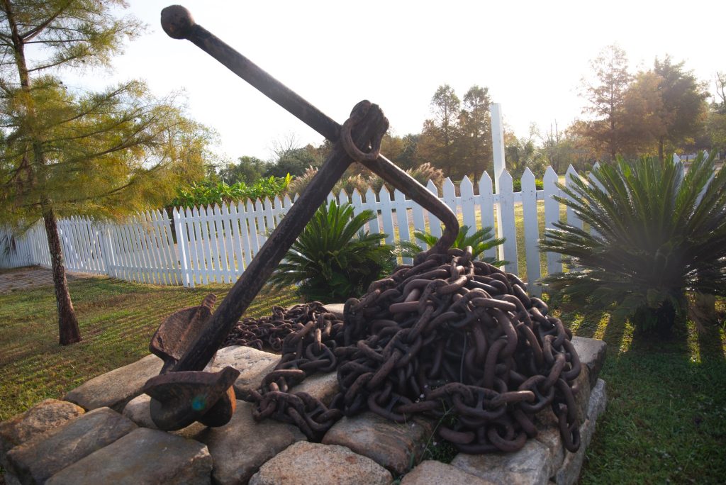 An anchor from a slave ship rests on display near the plantation entrance. Photographed by Finn Martin/BruinLife.