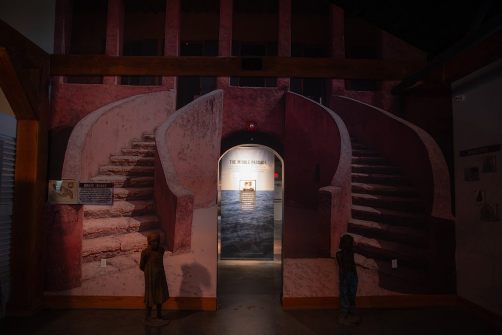 The Whitney Plantation museum's depiction of the Door of No Return, a reproduction the actual door built at the Maison des Esclaves on Gorée Island, Ghana, memorializing all those who were captured and deported to the Americas for bondage. Photographed by Finn Martin/BruinLife.