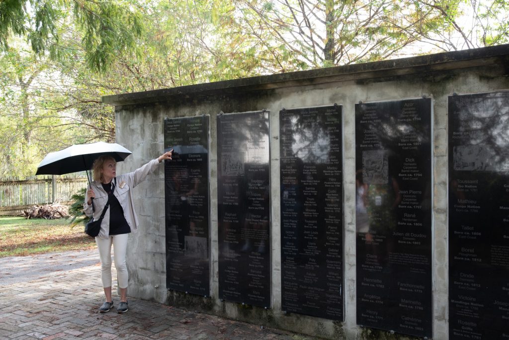 A monumental wall bears the names of former enslaved persons who passed through the plantation.  Many of those enslaved lost their former names in the middle passage across the Atlantic and were given Anglo names, sometimes resembling their enslavers. Photographed by Finn Martin/BruinLife.