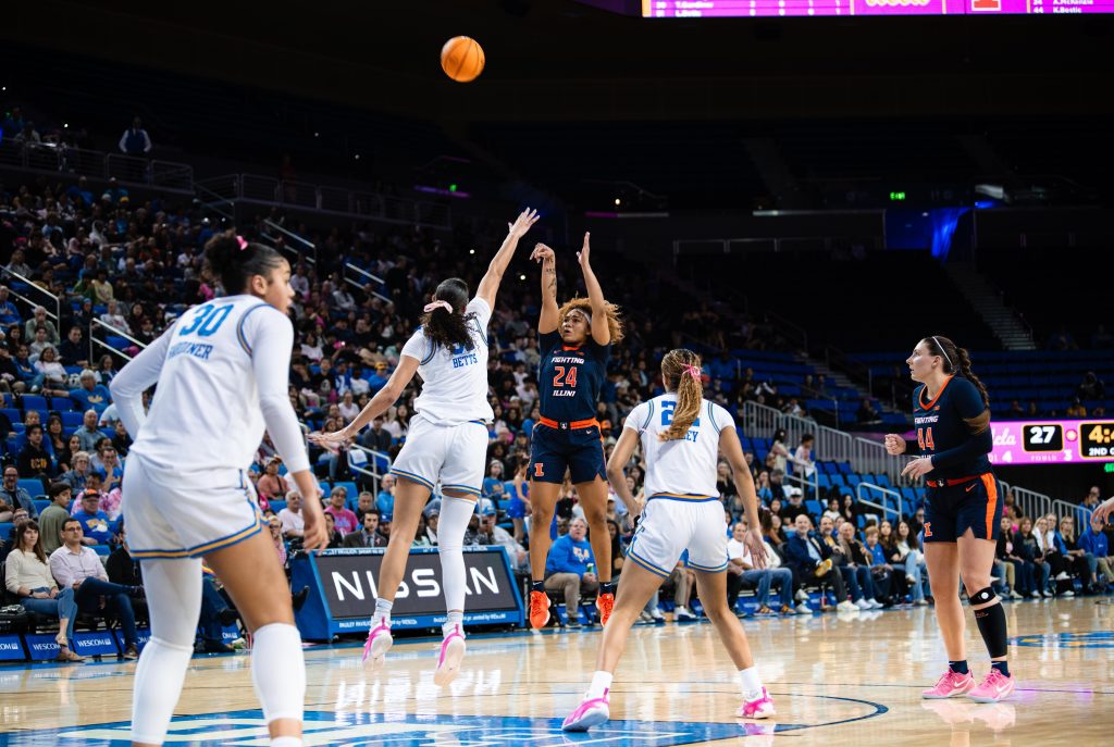 Illinois guard #24 Adalia McKenzie shoots over UCLA #51 Lauren Betts. Photographed by Ryan Zhang/BruinLife