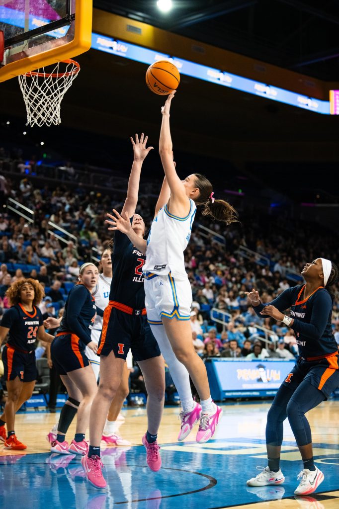 UCLA #11 Gabriela Jaquez shoots a floater in the key over Illinois #24 Berry Wallace. Photographed by Ryan Zhang/BruinLife