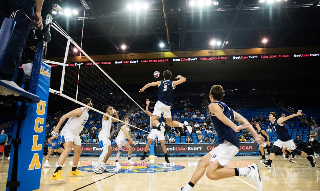 UCSB #3 Owen Birg, jumps high in the middle of the court to receive the set, ready to spike. Photographed by Ryan Zhang/BruinLife