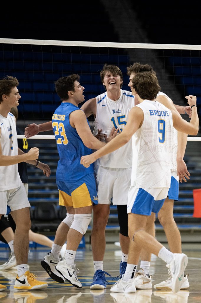 The Bruins celebrate a match point in the third set. UCLA brought in a total of 37 kills, nine aces, and 16 blocks against the Lions. Photographed by Julia Gu/BruinLife