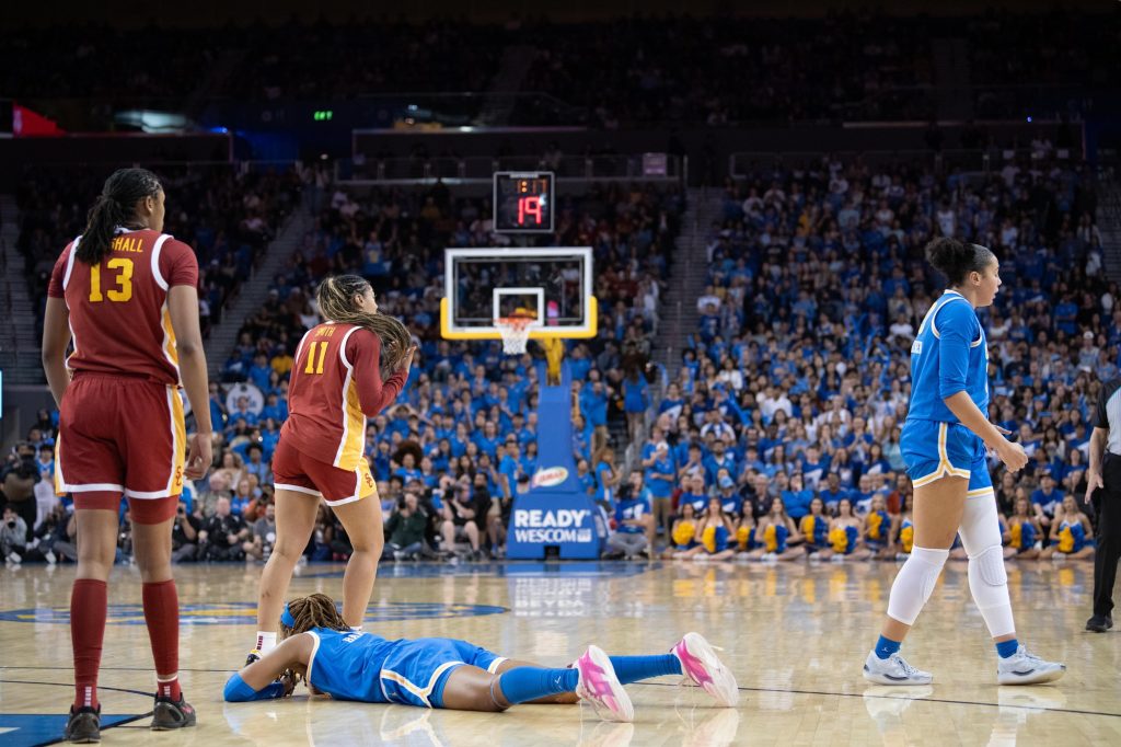 Janiah Barker lies on the floor after the ball goes out of bounds.