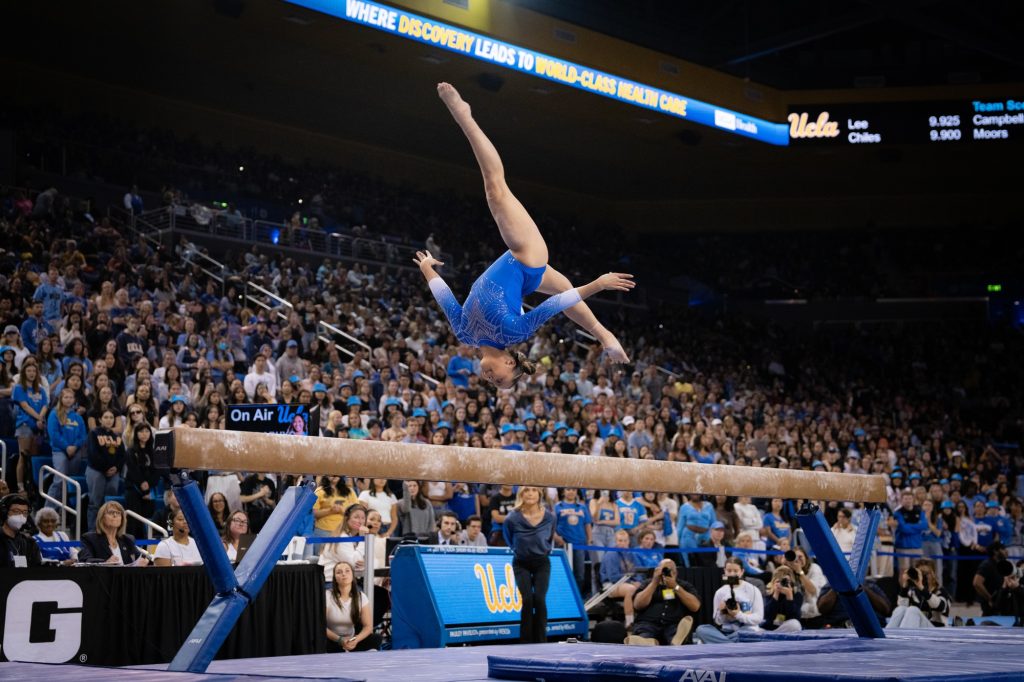 Emma Malabuyo performs an incredible jump on balance beam, securing a strong score of 9.925. Photographed by Cathryn Kuczynski/BruinLife.