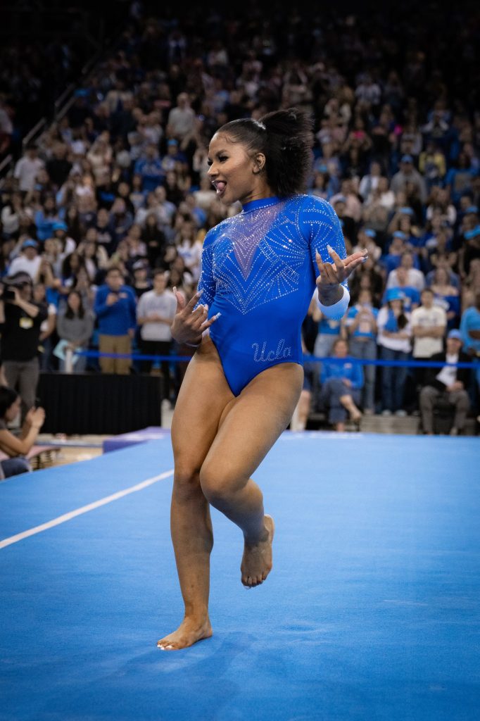 Junior Jordan Chiles puts on a stellar performance as she completes her floor routine, earning an impressive 9.950. Photographed by Cathryn Kuczynski/BruinLife.