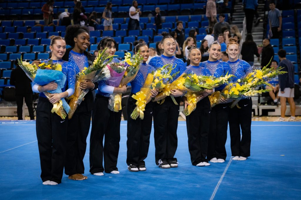 The seniors of the UCLA women’s gymnastics team gather at the end of their Senior Night meet versus Stanford to celebrate their accomplishments. Photographed by Cathryn Kuczynski/BruinLife.