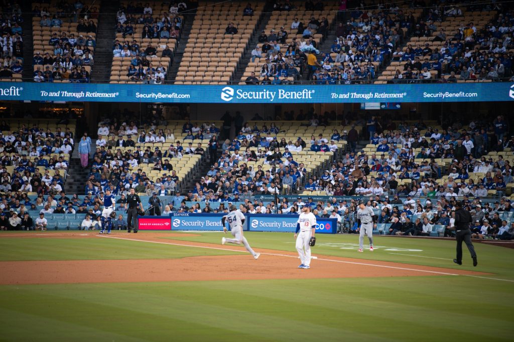 Dane Myers puts up a triple to start off the Marlins' offense.  Photograph by Finn Martin/BruinLife.