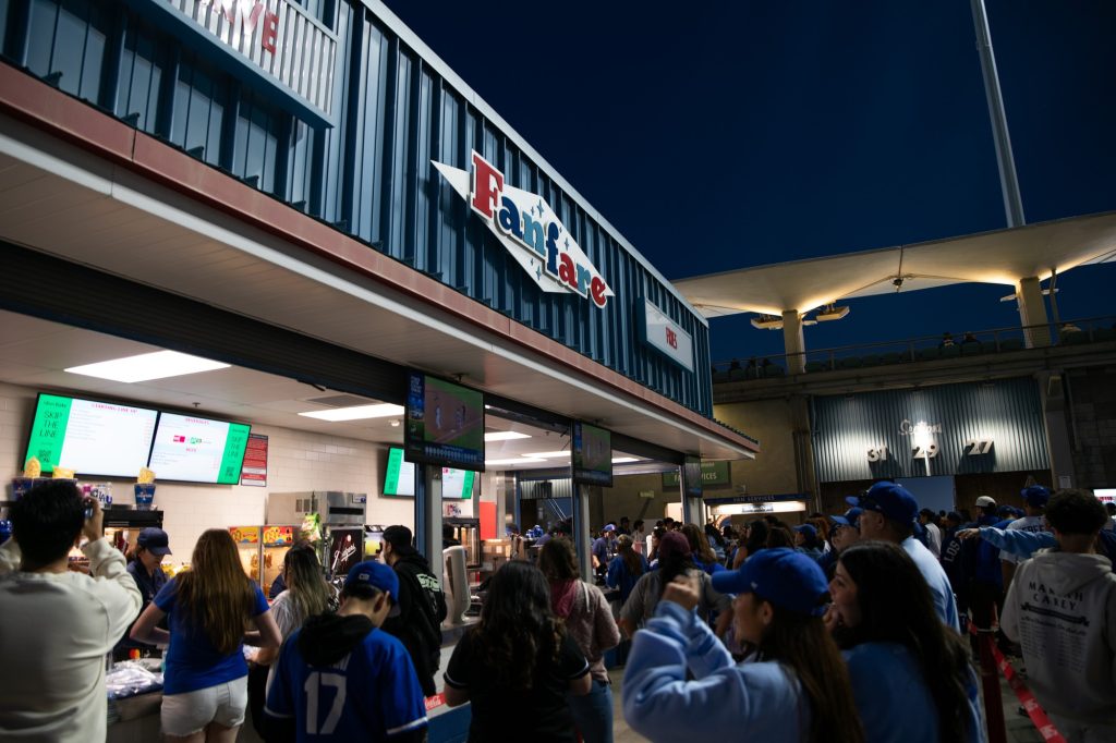 The line gathers at Fanfare for Dodger Dogs, pastrami burgers, and the one pound behemoth that is "The Slugger." Photographed by Finn Martin/BruinLife.