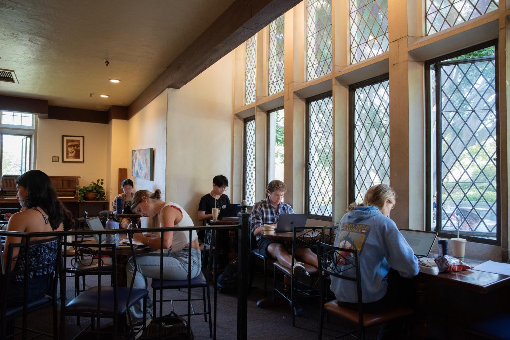 Students study and grab a bite to eat in UCLA's renowned Kerckhoff Coffeehouse. Kerckhoff has been a student favorite, serving up a delicious grilled cheese and tomato soup, which pairs perfectly with its cozy vibe and warm ambiance. Photographed by Regan Rhodes/BruinLife.