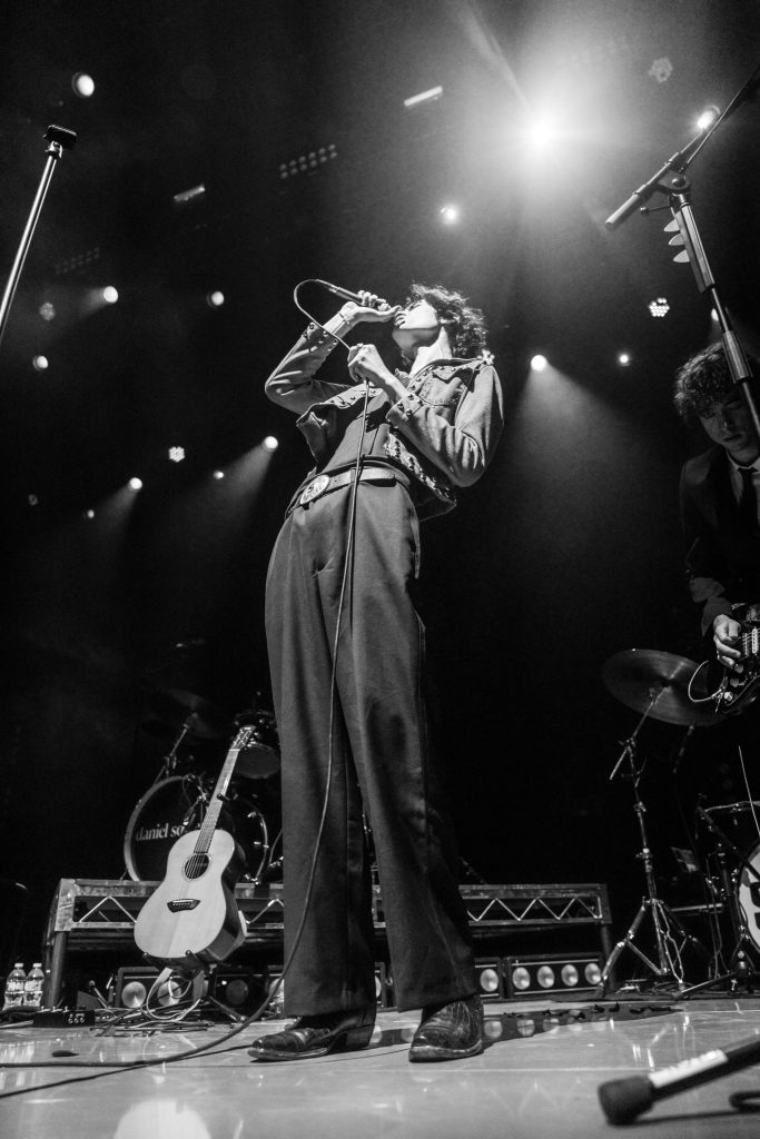 Sombr performs to an energetic crowd as they sing back the lyrics of his song titled "perfume". Photographed by Cathryn Kuczynski/Bruinlife.