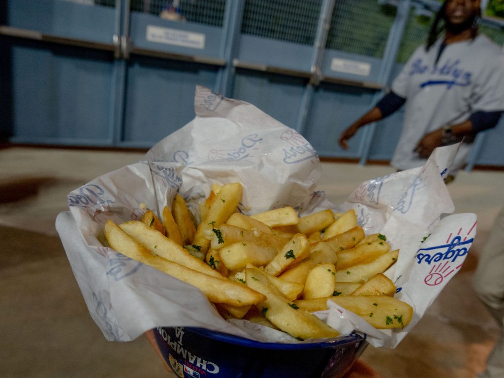 Garlic fries in a plastic baseball cap -- a staple of the stadium.Photo by Gavin Meichelbock/Bruin Life.