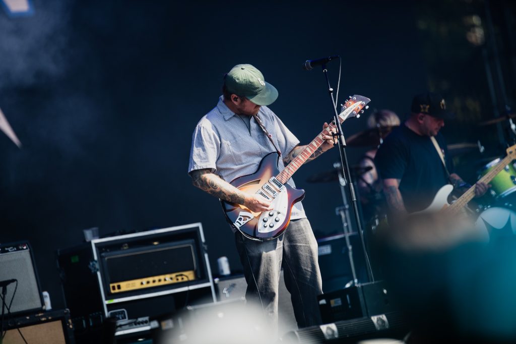 Kevin Geyer locks in on guitar, laying down sharp riffs that keep the energy high. Photographed by Ryan Zhang/BruinLife.