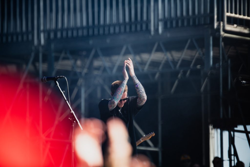 Parker Cannon claps along with the crowd, soaking in the moment with a grin. Photographed by Ryan Zhang/BruinLife.