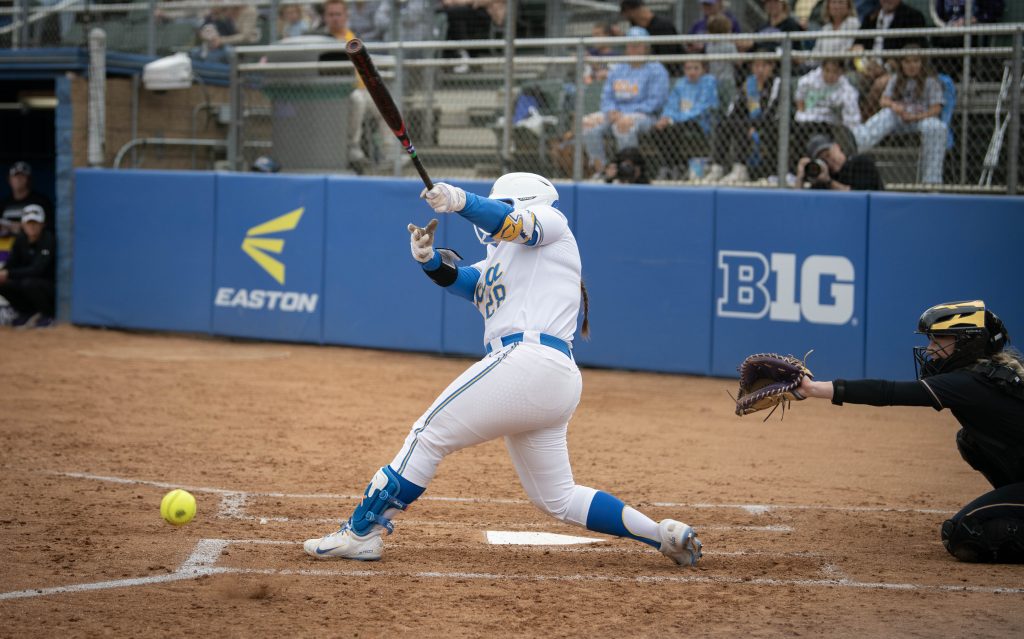 Alexis Ramirez swings, sending the ball into the left field. Photographed by Sapna Drew/BruinLife.