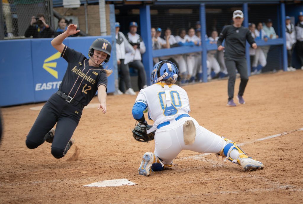 Sofia Mujica tries to protect home plate. Photographed by Sapna Drew/BruinLife.