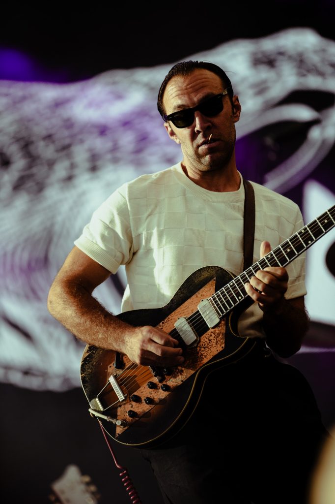 Zac Sokolow of LA LOM locks in with the rhythm, channeling vintage soul through his guitar.