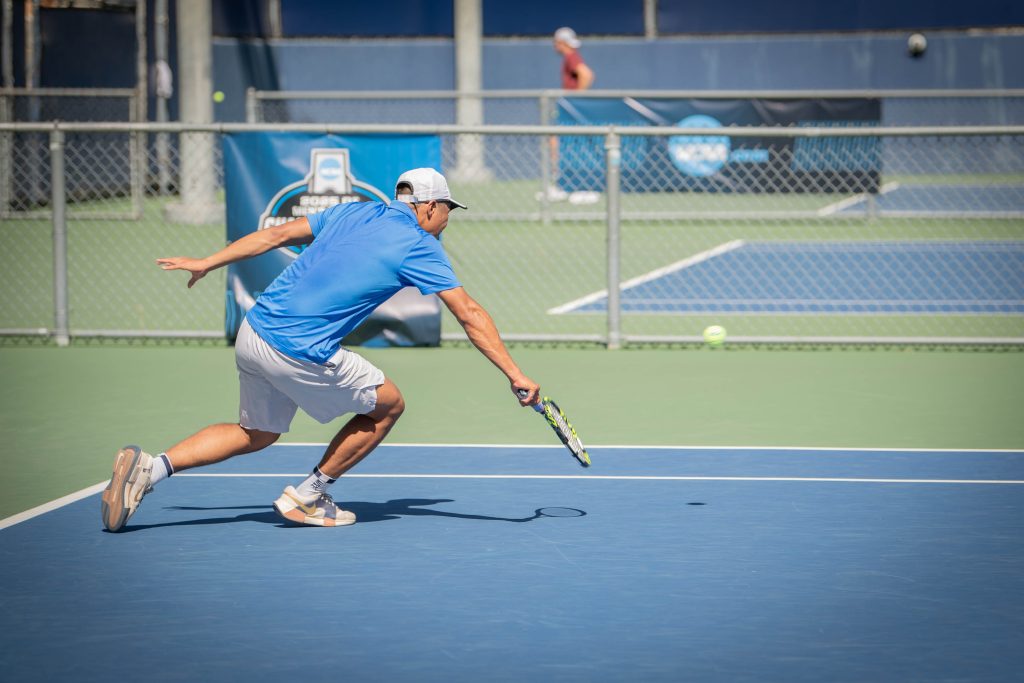 Rudy Quan darts forward as his opponent sends the ball lower than expected. Photographed by Sapna Drew/BruinLife.