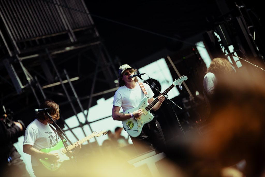 Campbell Burns sways with the music, his voice gliding over the shimmering guitar lines. Photographed by Ryan Zhang/BruinLife.