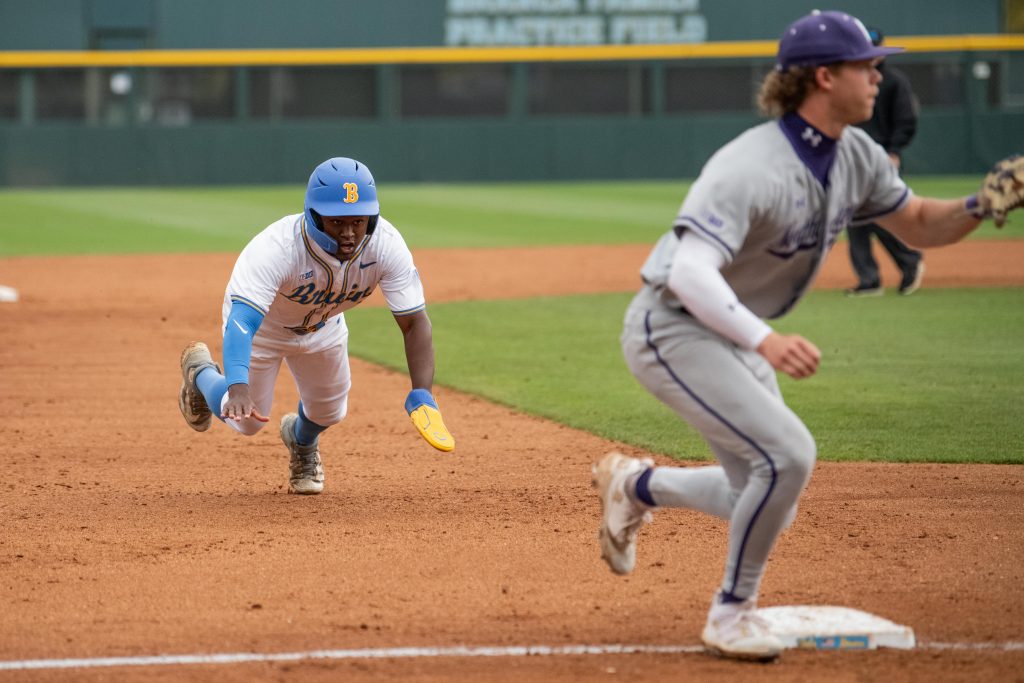 Dean West prepares for the dive into third base. Photographed by Maia Salti/BruinLife Photographed by Maia Salti/BruinLife