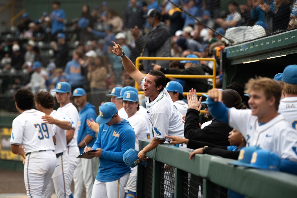UCLA erupts in celebration in the dugout after Roman Martin hits a home run. Photographed by Maia Salti/BruinLife Photographed by Maia Salti/BruinLife
